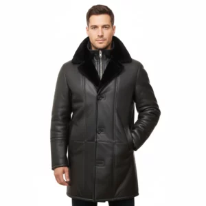 Full front view of a man wearing a black sheepskin coat with a faux fur collar and button closure, standing against a white background.